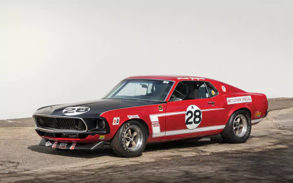 Red and black Ford Mustang Boss 302 muscle race car (#28) parked on track, classic Ford vehicle, 4K Ultra HD PC desktop wallpaper and background.