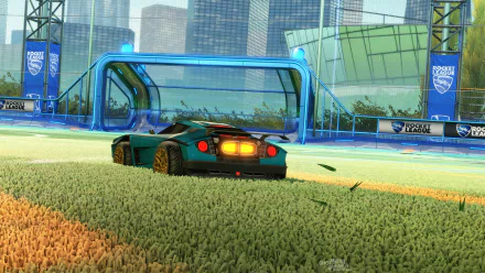 HD PC desktop wallpaper/background from Rocket League: a customized car on grass aiming toward a blue goal in a stadium arena with bright lights and a city skyline.