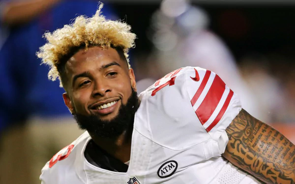 HD desktop wallpaper featuring a New York Giants player smiling in uniform, suited for fans of the team and the athlete.