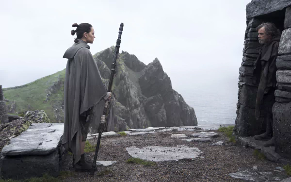 Scene from Star Wars: The Last Jedi featuring Rey and Luke Skywalker on a rocky island, presented in 4K Ultra HD for PC desktop wallpaper.