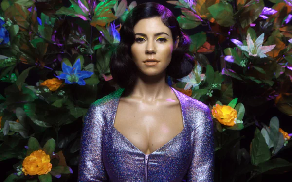 2K Quad HD PC wallpaper, music-themed: stylized female singer in a shimmering purple outfit amid lush foliage with yellow and blue flowers.