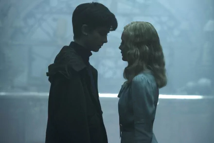 HD desktop wallpaper featuring Ella Purnell and Asa Butterfield in a still from the movie Miss Peregrine's Home for Peculiar Children, standing face-to-face in a misty, atmospheric setting.