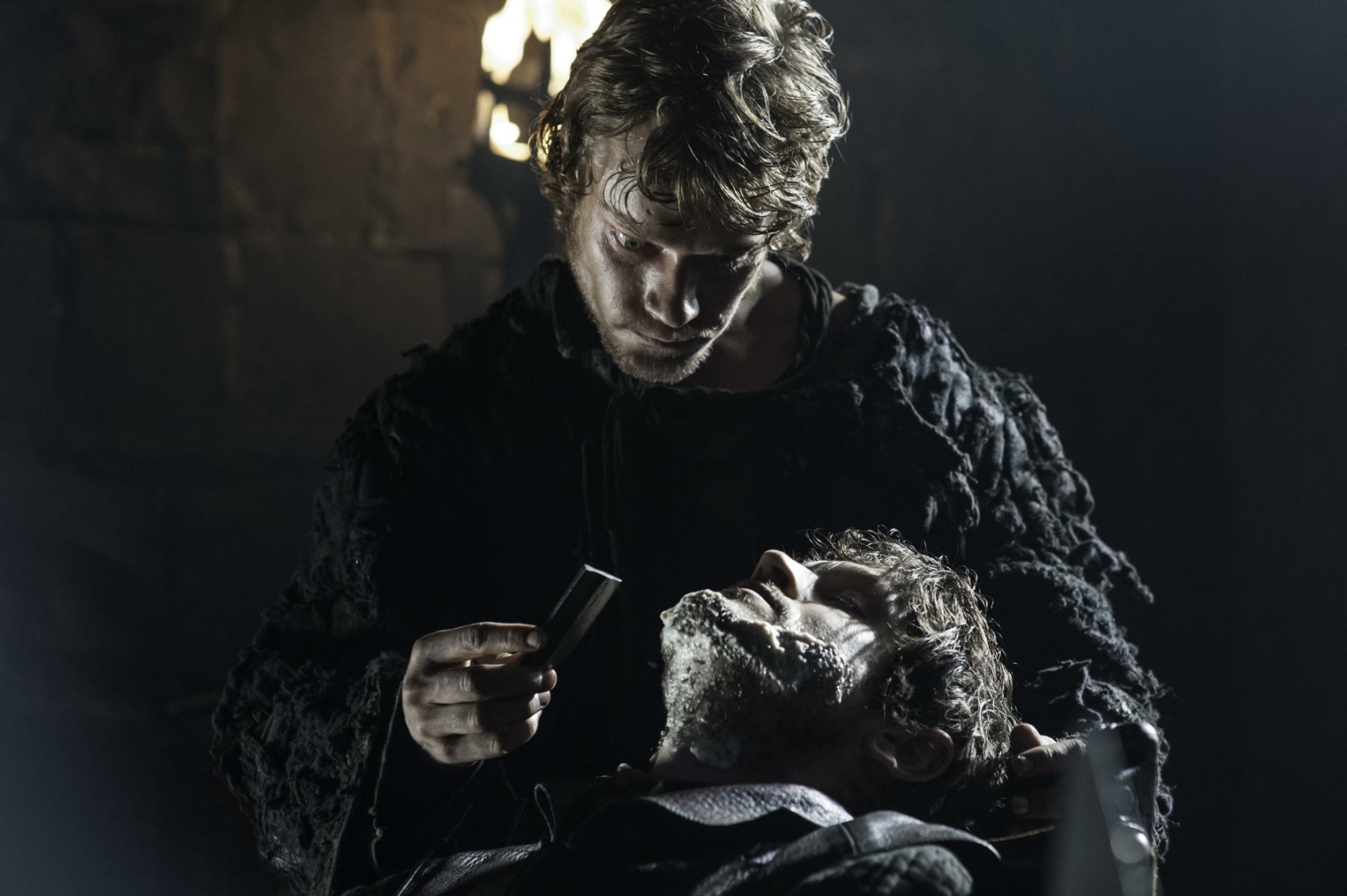 Iwan Rheon as Ramsay Bolton and Alfie Allen as Theon Greyjoy from the TV show Game of Thrones featured in an HD PC desktop wallpaper.
