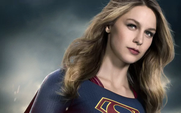 Melissa Benoist as Supergirl, showcasing her superhero persona against a dramatic background, in this HD desktop wallpaper.