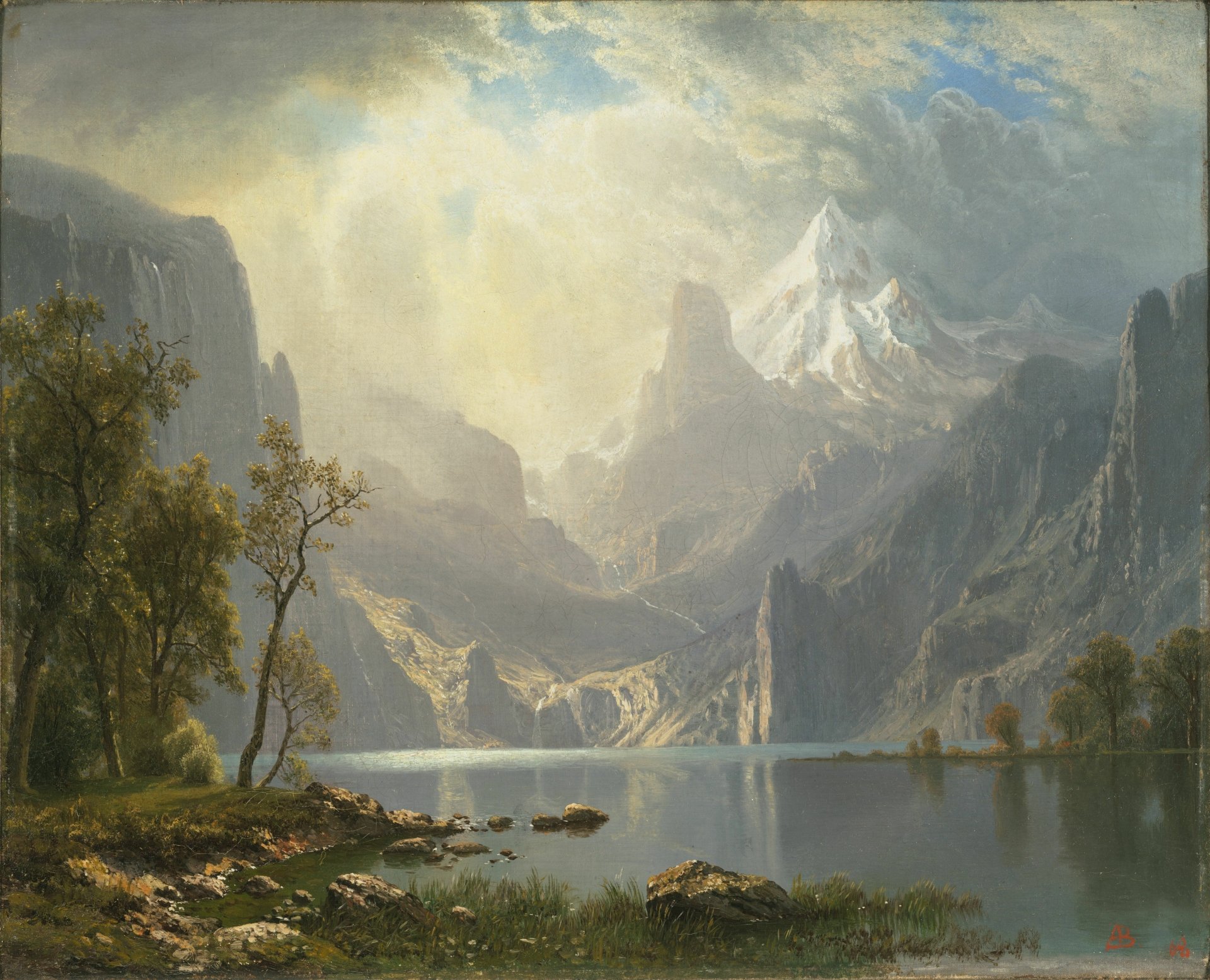 HD artistic wallpaper depicting a serene lake surrounded by towering mountains. The landscape features lush trees and a snow-capped peak under a bright, cloudy sky.