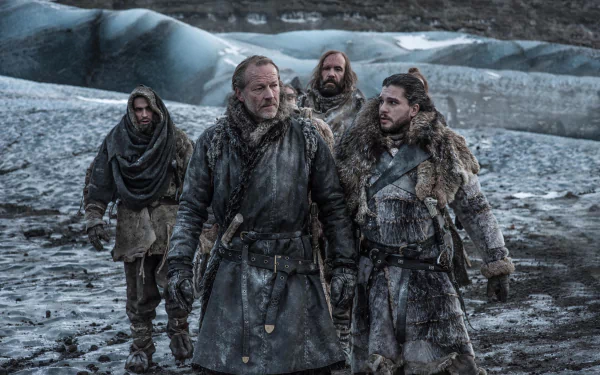 4K Ultra HD Game of Thrones TV wallpaper: four fur-clad warriors in weathered armor stride across a bleak, snowy shoreline, cloaks and weapons dusted with snow and mud.