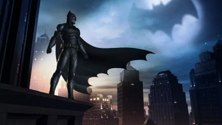 HD desktop wallpaper featuring Batman from Batman: The Telltale Series standing on a Gotham City rooftop with the Bat-Signal shining in the sky.