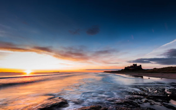 sky ocean horizon sunset England castle man made Bamburgh Castle HD Desktop Wallpaper | Background Image