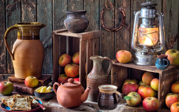 A 4K Ultra HD still life photography featuring a teapot, vase, lantern, and apples arranged on rustic wooden crates and surfaces as a PC desktop wallpaper.