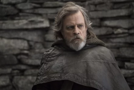 Mark Hamill as Luke Skywalker in Star Wars: The Last Jedi, featured in a 4K Ultra HD PC desktop wallpaper with a rugged stone backdrop.