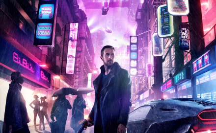 HD desktop wallpaper from the movie Blade Runner 2049 featuring Officer K (Ryan Gosling) standing in a neon-lit cityscape.