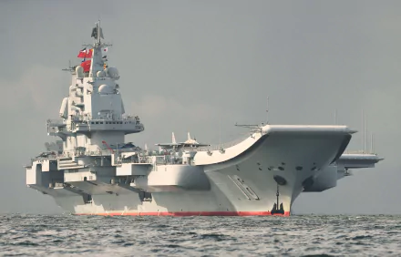 HD desktop wallpaper of the Chinese aircraft carrier Liaoning, showcasing the impressive warship as it navigates the waters.