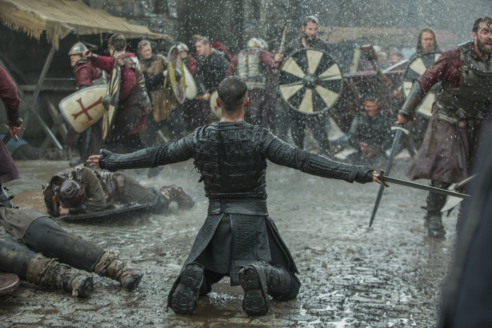 A dramatic battle scene from the TV show Vikings (2013) in 4K Ultra HD, featuring intense medieval combat and warriors in detailed armor on a rain-soaked battlefield.