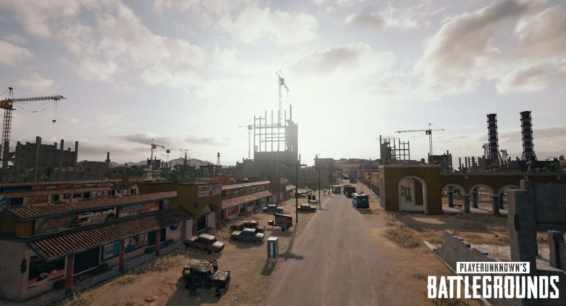 HD desktop wallpaper featuring a detailed street scene from the video game Playerunknown's Battlegrounds, with buildings, vehicles, and cranes under a bright sky.