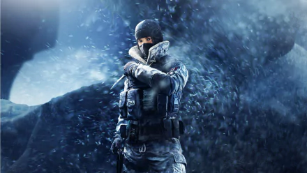 HD desktop wallpaper featuring a character from Tom Clancy's Rainbow Six: Siege, standing in a snowy, stormy environment with a determined look, clad in tactical winter gear.