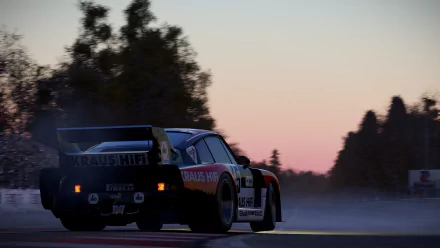 Rear view of a Porsche 935 racing at dusk in the video game Project Cars 2, wet track spray and tree-lined horizon — 4K Ultra HD PC desktop wallpaper.