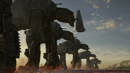 HD desktop wallpaper featuring a line of AT-AT Walkers from Star Wars: The Last Jedi against a dramatic sky at dusk.