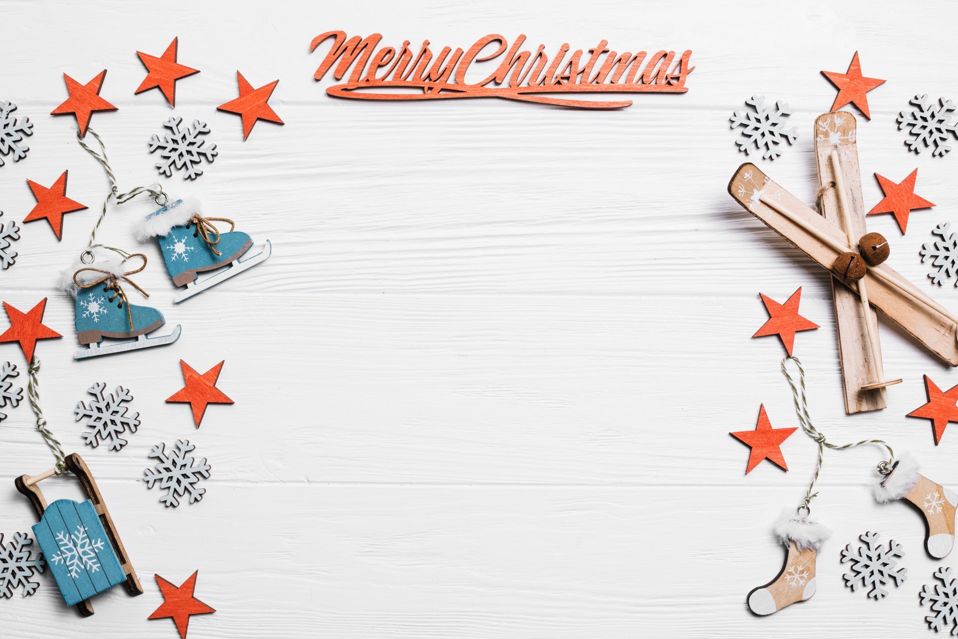 Merry Christmas 4K Ultra HD desktop wallpaper featuring festive ice skates, sleds, snowflakes, and red stars on a white wooden background.