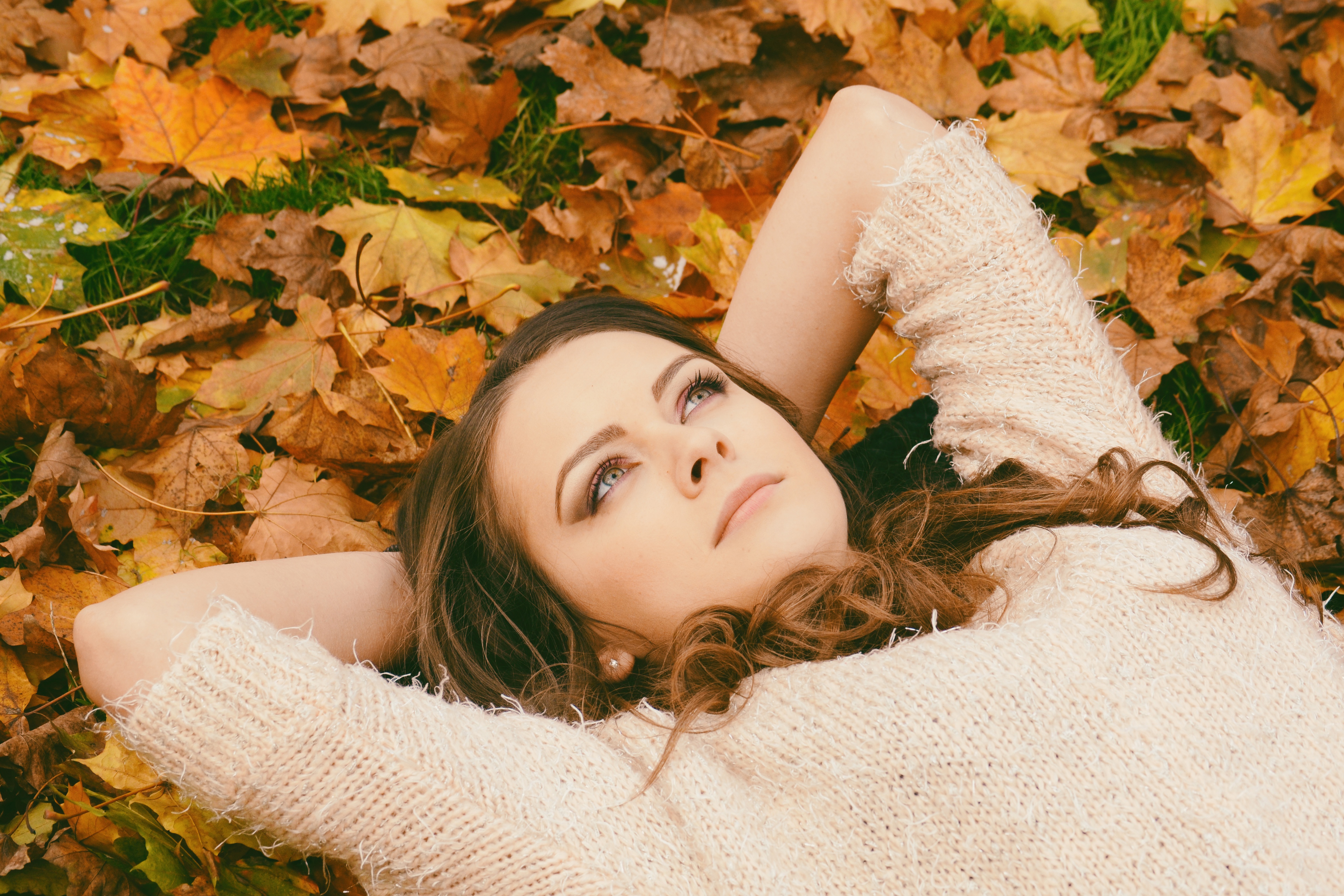 Download Brunette Leaf Fall Lying Down Model Woman Mood 4k Ultra Hd