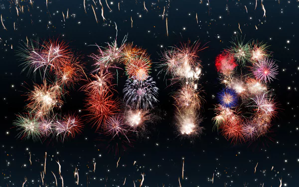 Colorful fireworks form the numbers 2018 against a dark sky, celebrating the New Year holiday in vibrant 8K Ultra HD quality.