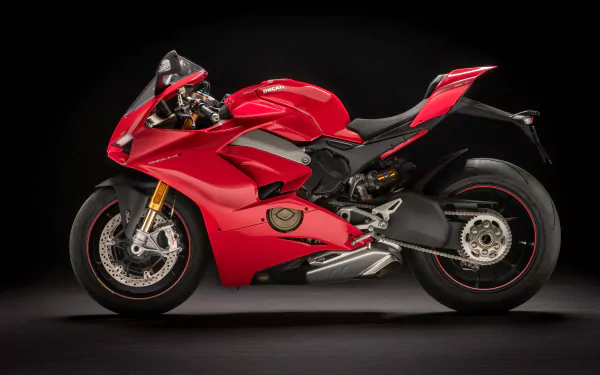 Red Ducati Panigale V4 motorcycle showcased on black background, captured in stunning 4K Ultra HD as a dynamic PC desktop wallpaper and background.