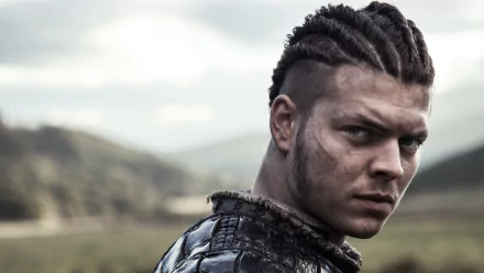 HD PC desktop wallpaper of Ivar The Boneless from the TV show Vikings (2013), featuring a close-up of his intense, braided hairstyle and rugged appearance in an outdoor setting.