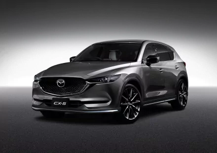 HD desktop wallpaper featuring a sleek black Mazda CX-5 SUV showcased against a gradient gray background.