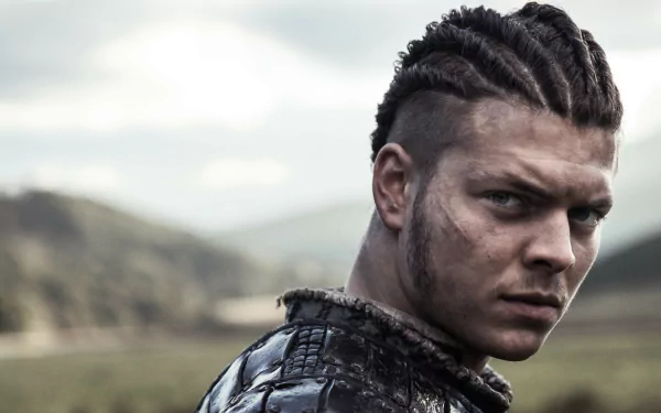 HD PC desktop wallpaper of Ivar The Boneless from the TV show Vikings (2013), featuring a close-up of his intense, braided hairstyle and rugged appearance in an outdoor setting.