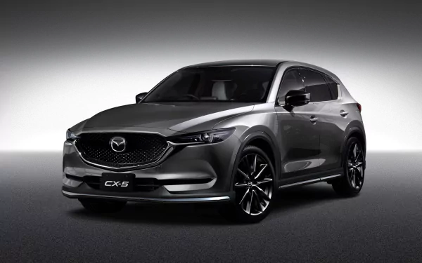 HD desktop wallpaper featuring a sleek black Mazda CX-5 SUV showcased against a gradient gray background.