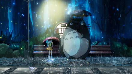 HD desktop wallpaper featuring Mei Kusakabe and Totoro from the anime My Neighbor Totoro, standing under umbrellas at a bus stop in the rain, with a magical forest background.