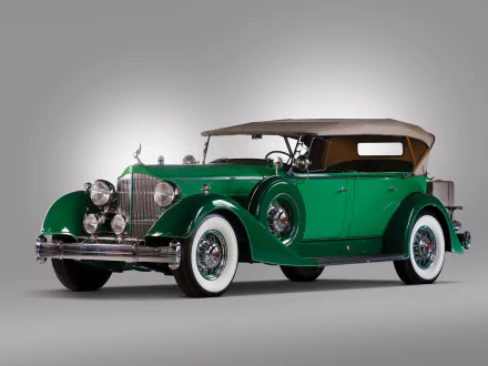 HD desktop wallpaper featuring a vintage green Packard Twelve convertible with classic whitewall tires and a tan soft top.