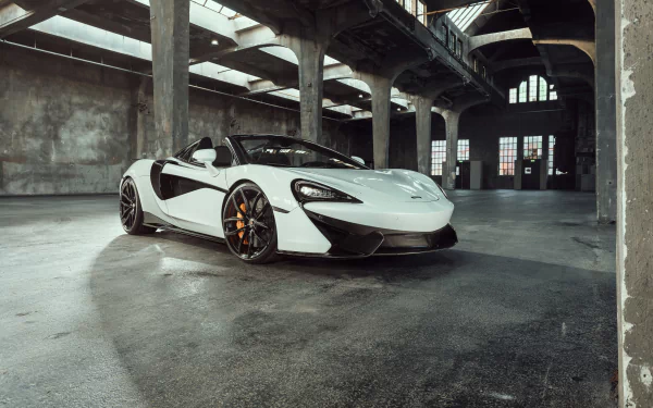 A white McLaren Senna supercar parked inside an industrial building, captured in a 4K Ultra HD PC desktop wallpaper and background.
