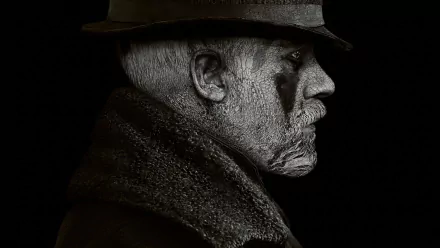 HD PC desktop wallpaper of a moody side-profile of a weathered man in a period hat and coat, a dark streak by his eye, set against a high-contrast black background — TV show Taboo.