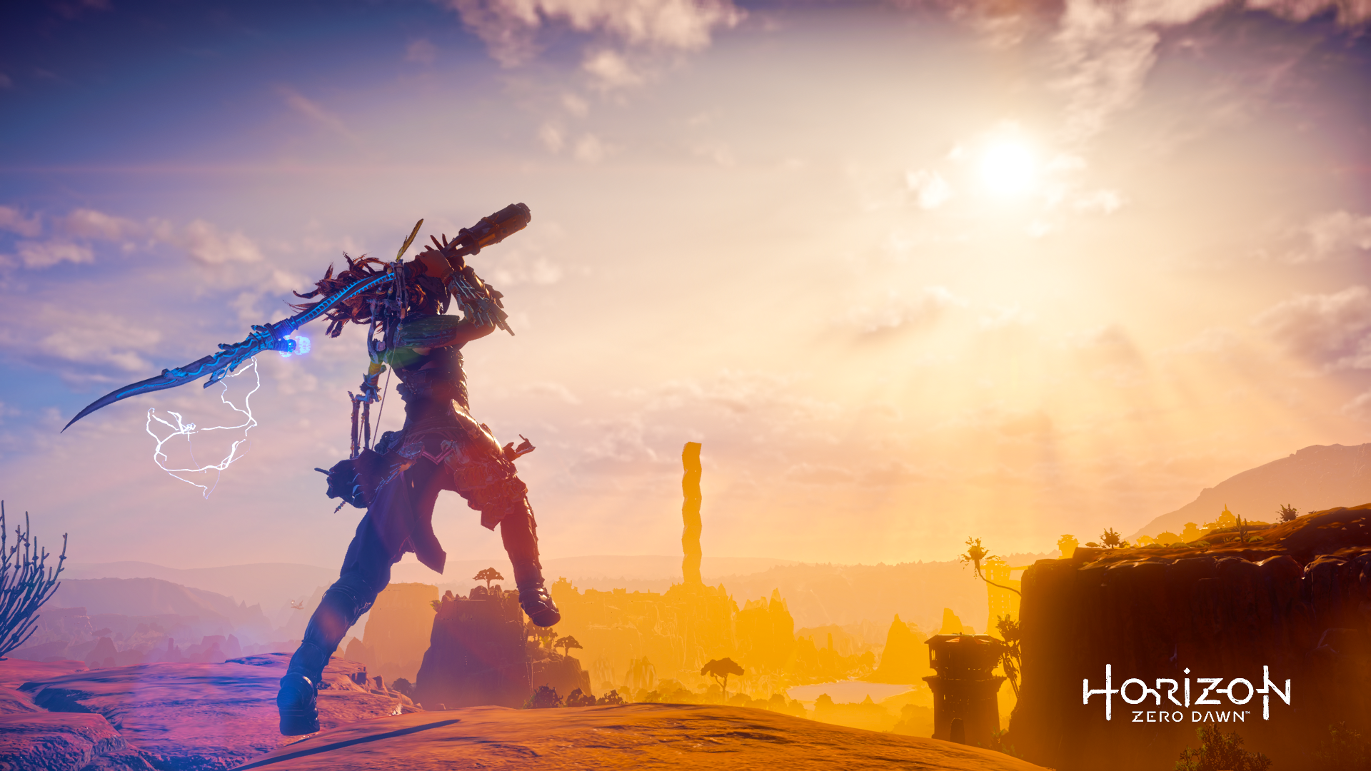 HD PC desktop wallpaper featuring Aloy from Horizon Zero Dawn poised against a vibrant sunset landscape, capturing the game's adventurous spirit.