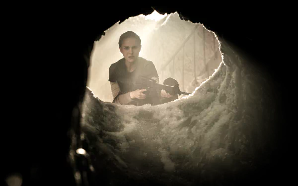 HD wallpaper featuring a character played by Natalie Portman peering through an opening, from the film Annihilation.