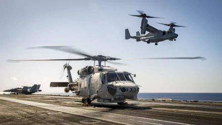 HD desktop wallpaper featuring military aircraft, including a Sikorsky SH-60 Seahawk helicopter on deck and a Bell Boeing V-22 Osprey tiltrotor aircraft flying above.