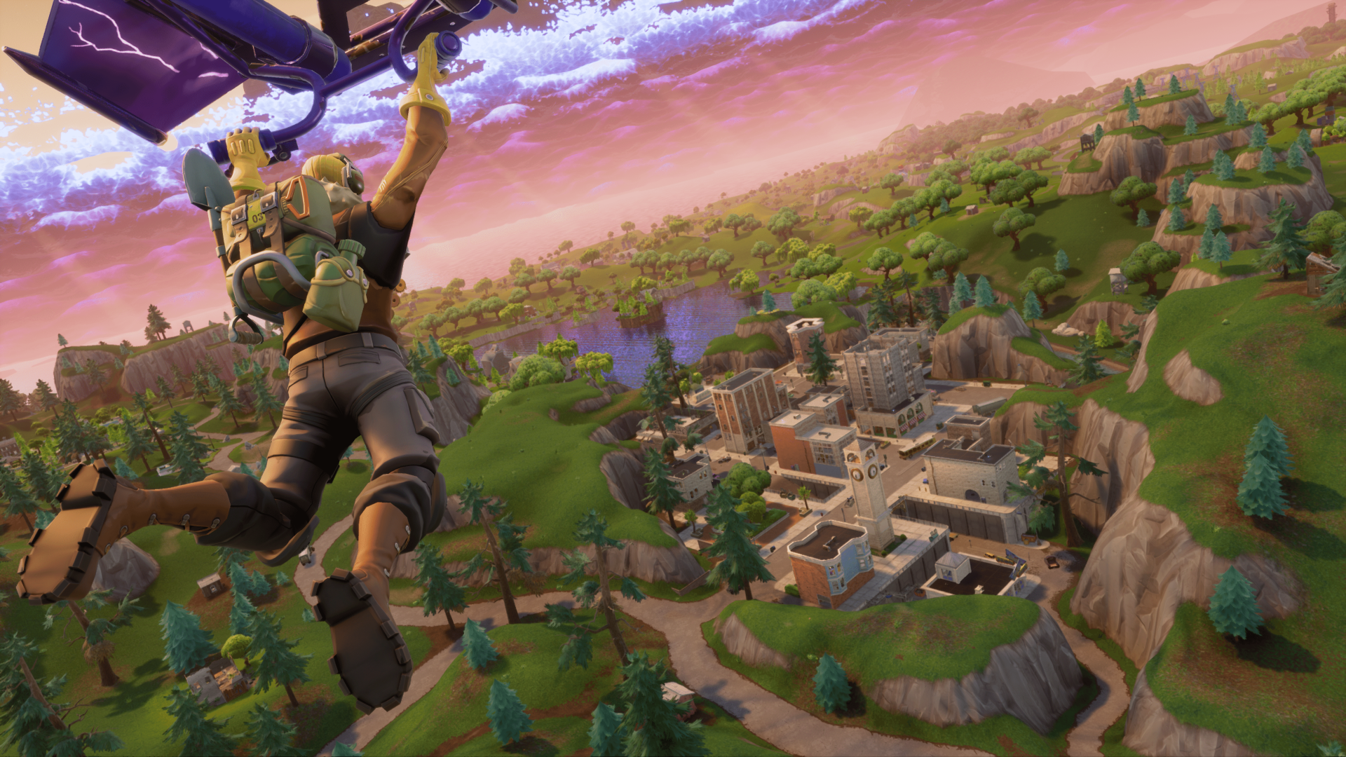A Fortnite character glides down towards a vibrant landscape with buildings and greenery under a dramatic sky. This HD desktop wallpaper captures an iconic moment from the popular video game.