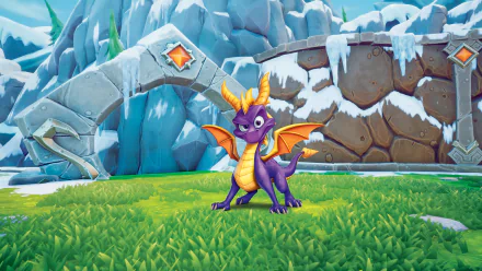 HD desktop wallpaper featuring Spyro the Dragon from the video game Spyro Reignited Trilogy, captured in a vibrant, snowy landscape with icy mountains and green grass.
