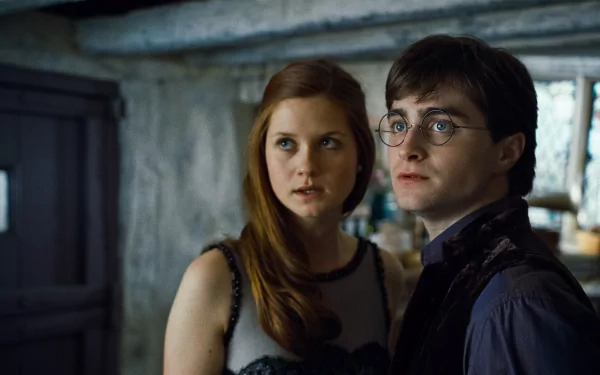 HD PC desktop wallpaper: Harry Potter and Ginny Weasley together in a scene from the movie Harry Potter and the Deathly Hallows: Part 1.