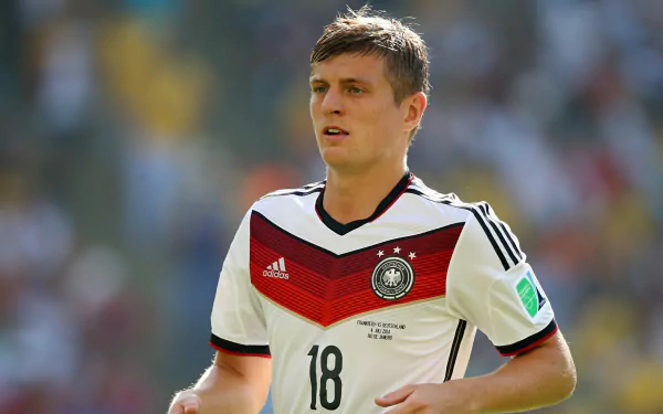 HD desktop wallpaper of German soccer player Toni Kroos in the national team jersey during a match.