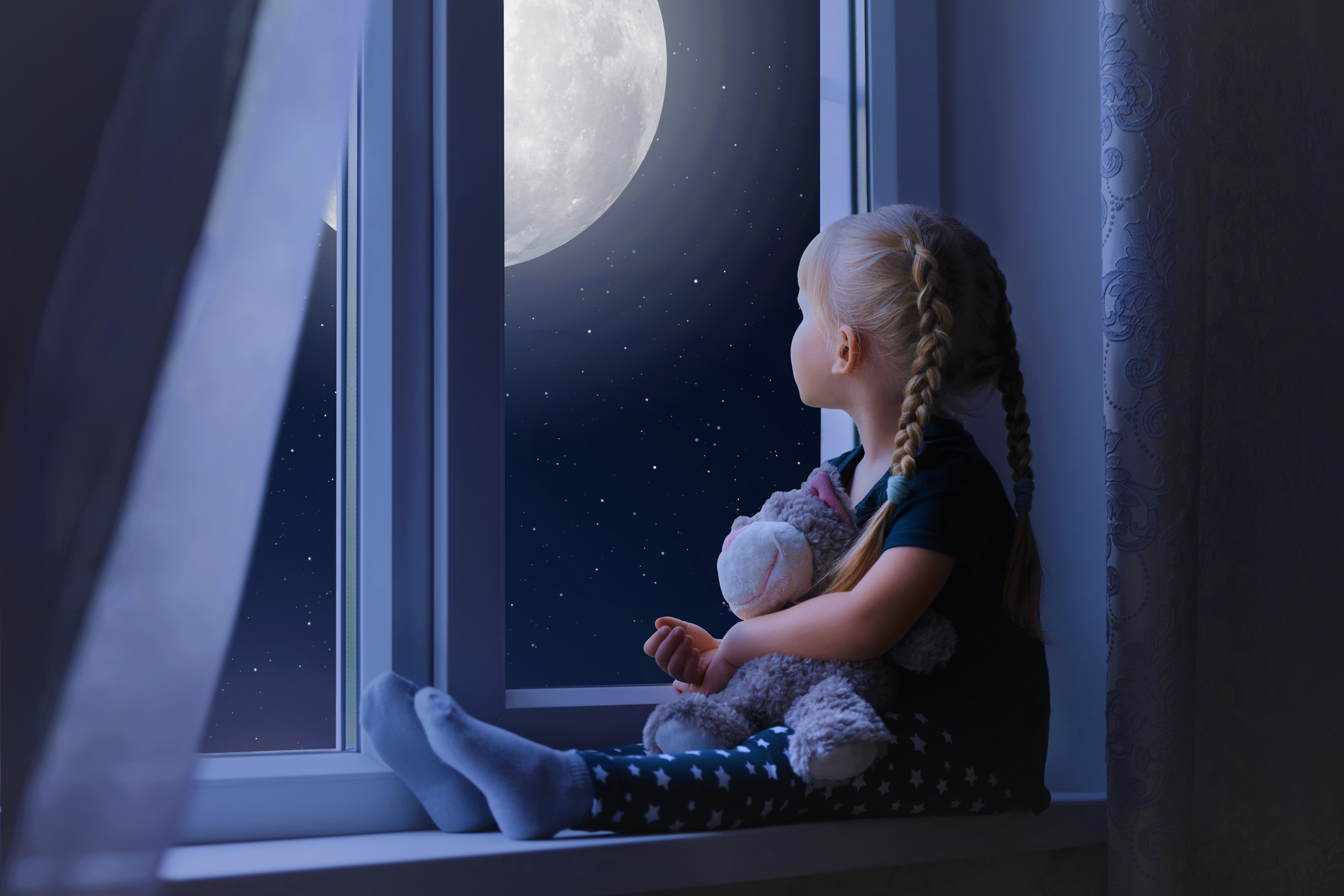 Little Girl Looking Out Window at Full Moon