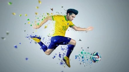 Dynamic Photoshop-style 4K Ultra HD PC desktop wallpaper and background: a male soccer player in yellow and blue fragmenting into colorful particles as he leaps to kick a ball, high-energy sports action.