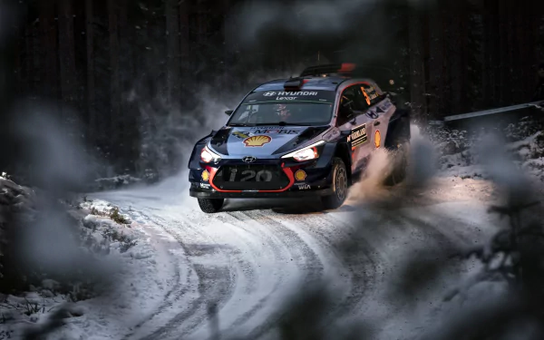 A rallying race car speeds through a snowy forest track, captured in stunning 4K Ultra HD as a dynamic sports vehicle in action.