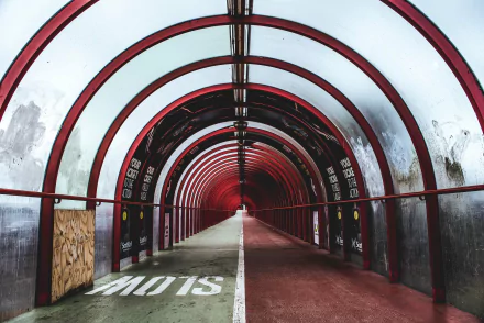 Glasgow man-made red arched tunnel with a central white line, moody 2K Quad HD PC desktop wallpaper and background.