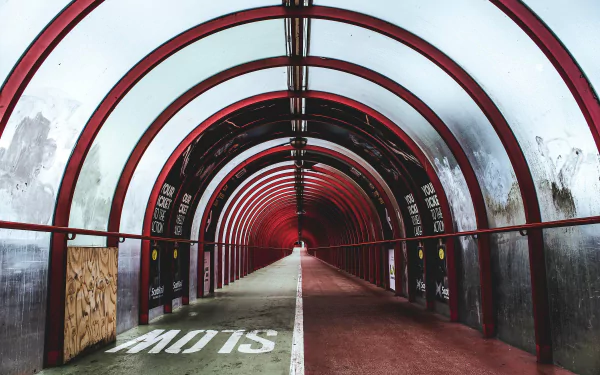 Glasgow man-made red arched tunnel with a central white line, moody 2K Quad HD PC desktop wallpaper and background.