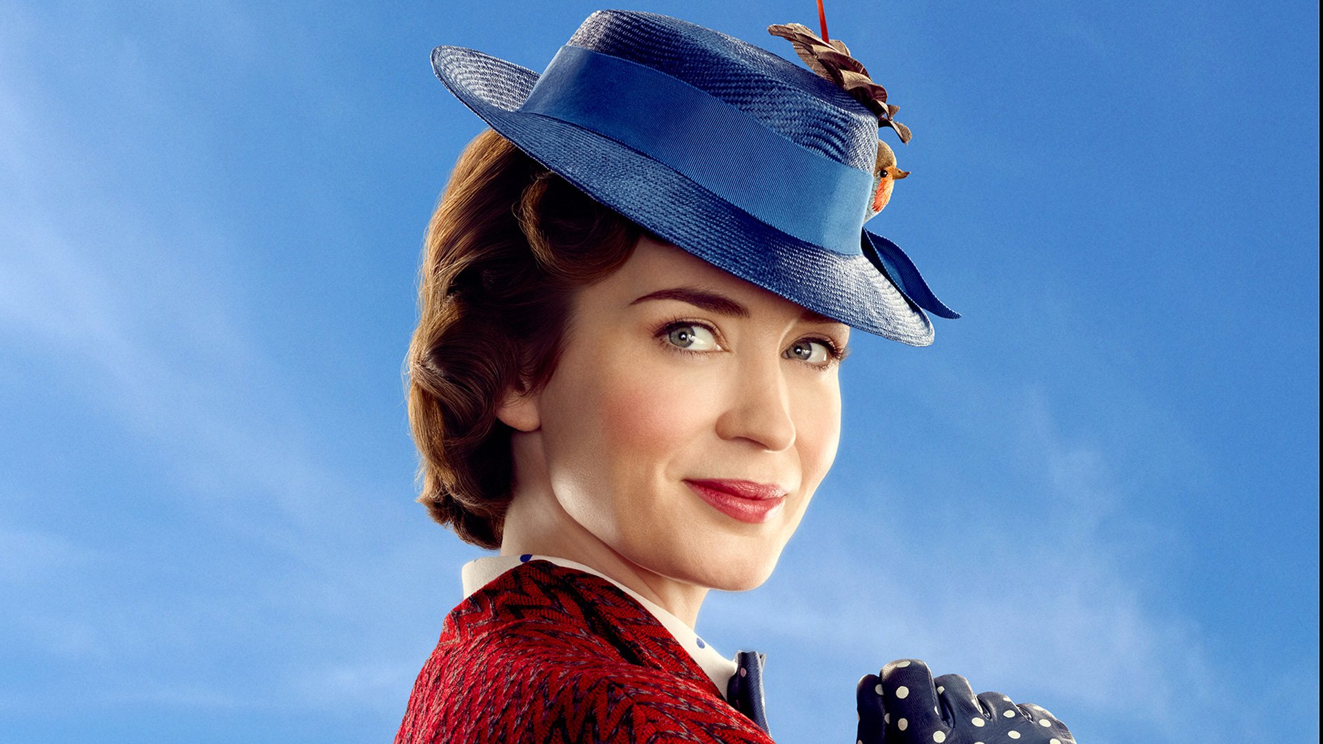 HD desktop wallpaper featuring Emily Blunt as Mary Poppins from the movie Mary Poppins Returns, against a clear blue sky background.