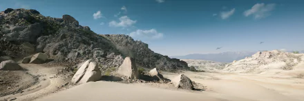 Rocky desert cliffs and sandy dunes beneath a blue sky from Battlefield V video game, 4K Ultra HD PC desktop wallpaper.