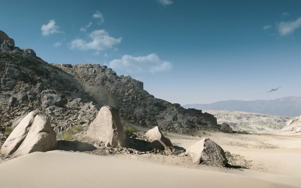 Rocky desert cliffs and sandy dunes beneath a blue sky from Battlefield V video game, 4K Ultra HD PC desktop wallpaper.