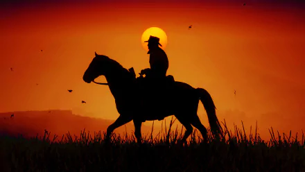 Silhouette of a cowboy riding a horse against a vibrant sunset, inspired by the western themes of the video game Red Dead Redemption 2. HD desktop wallpaper and background.