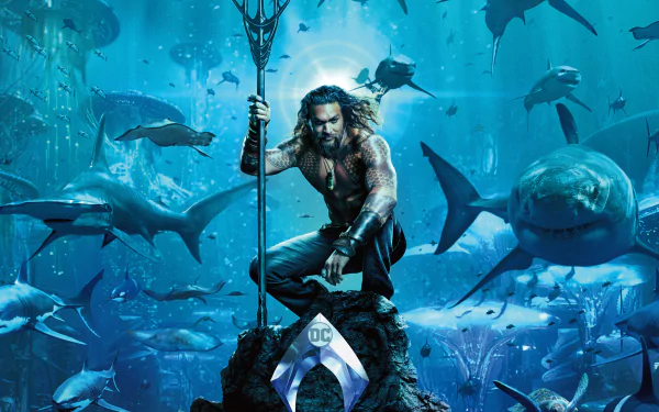 HD desktop wallpaper featuring Jason Momoa as Aquaman surrounded by marine life, inspired by the DC Comics movie Aquaman.